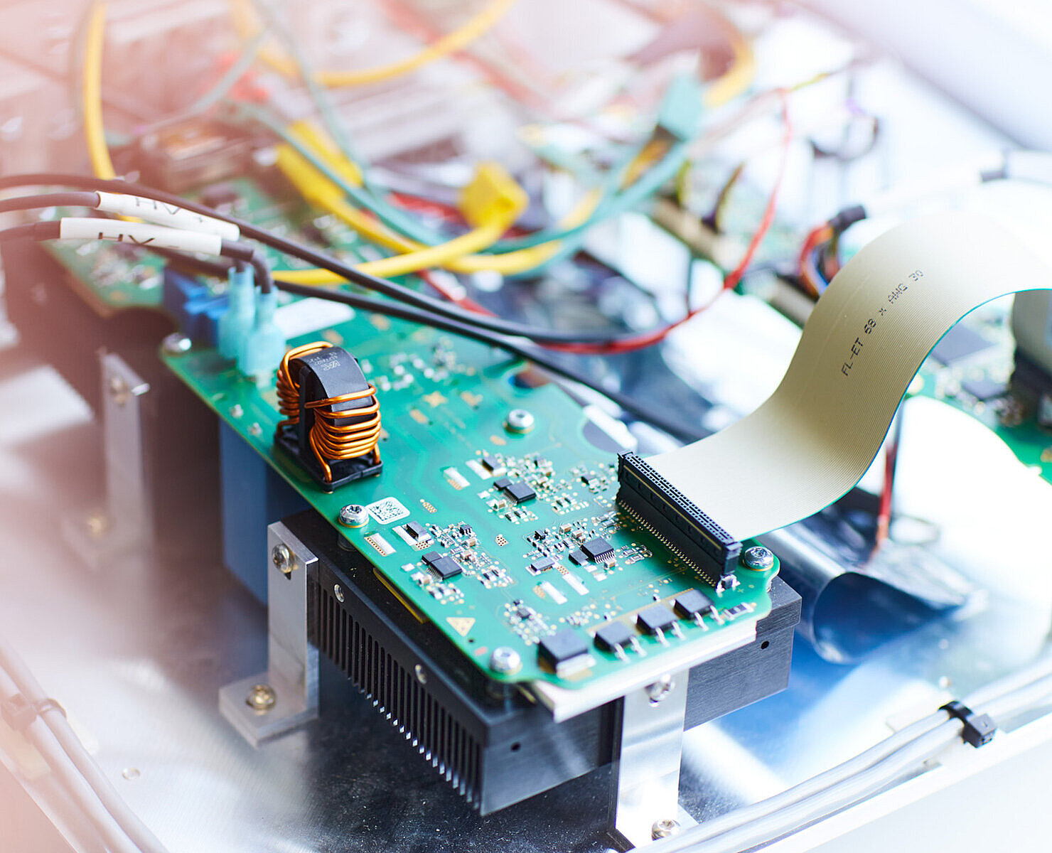 Electronic circuit board of a Silver Atena development and test system with connected cables and components.