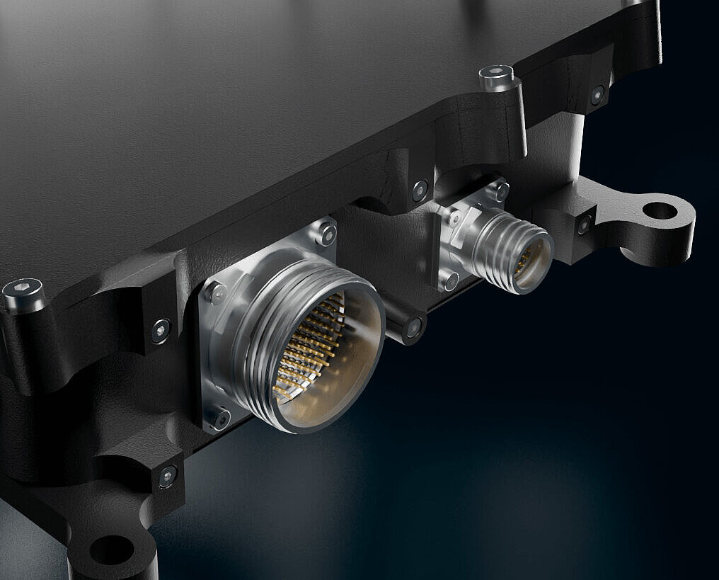 Close-up of the Silver Atena flight control computer with aerospace connectors in a rugged housing.