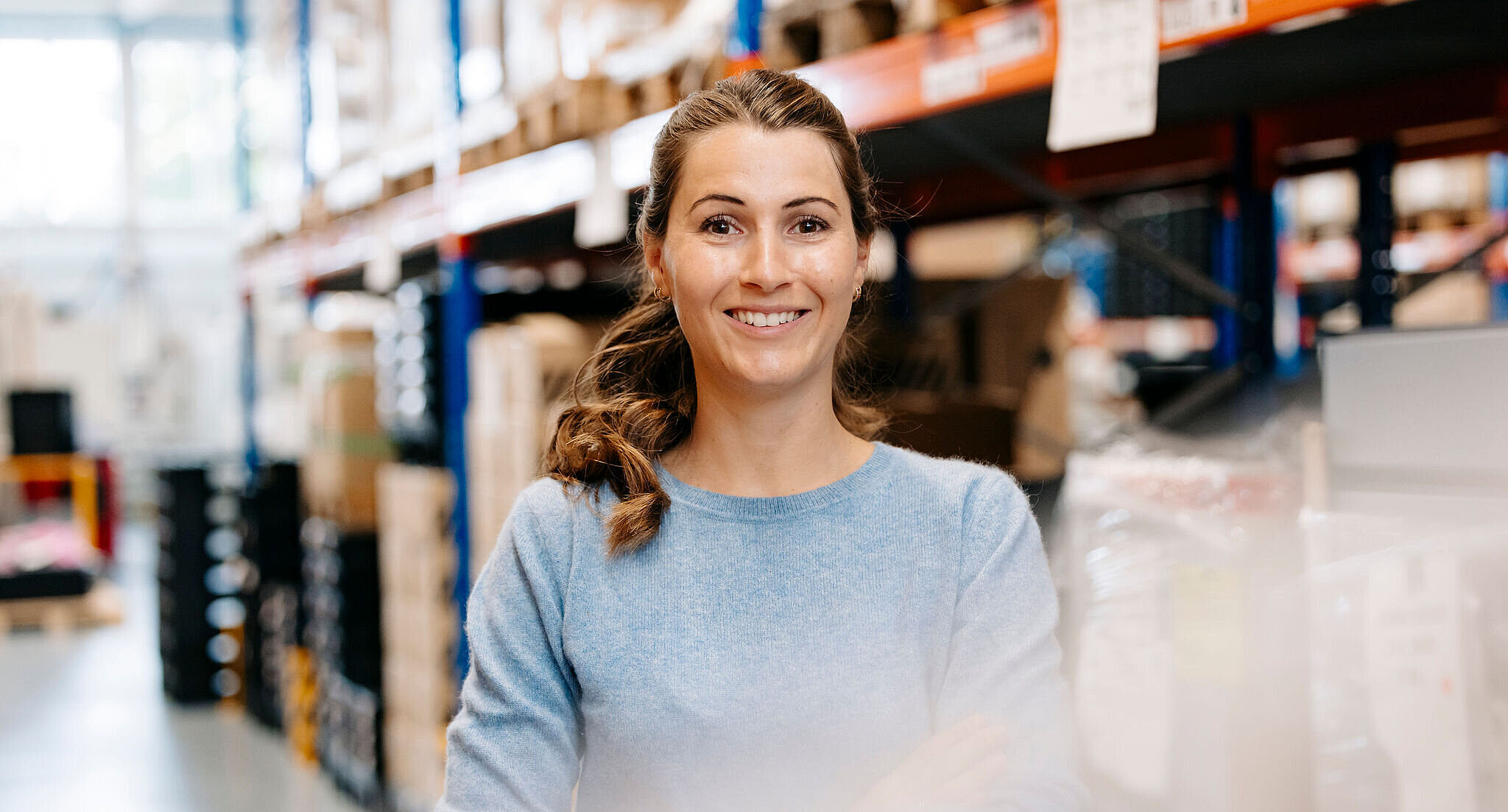 Silver Atena employee working in the logistics area of the warehouse.