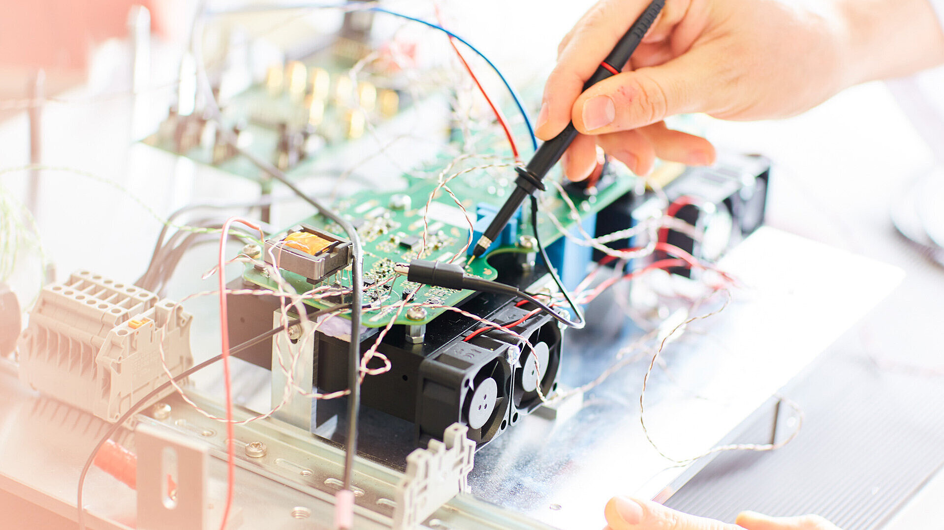 Measurement on an electronic circuit board in a power electronics laboratory.