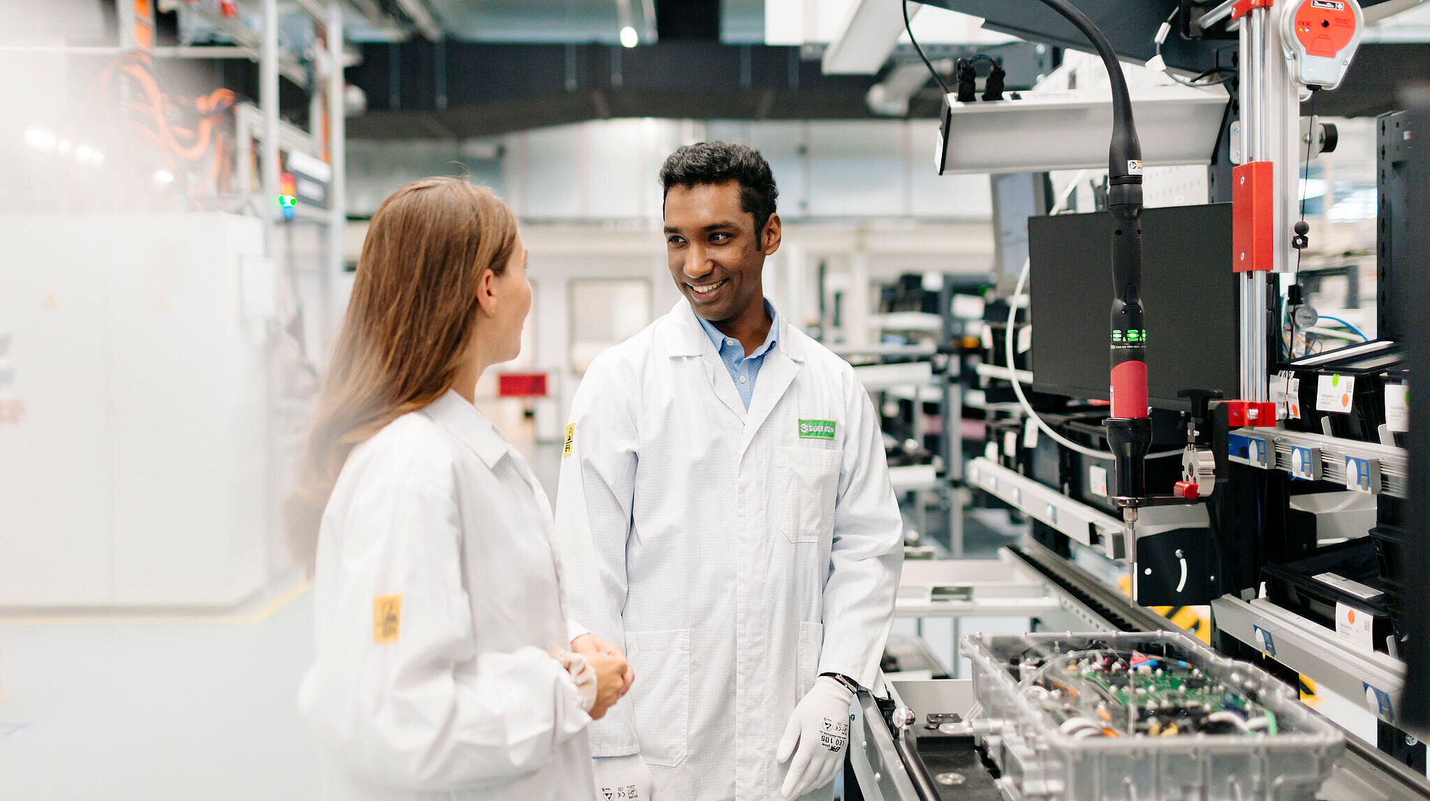 Silver Atena engineers inspecting an electronic system during assembly and quality control.