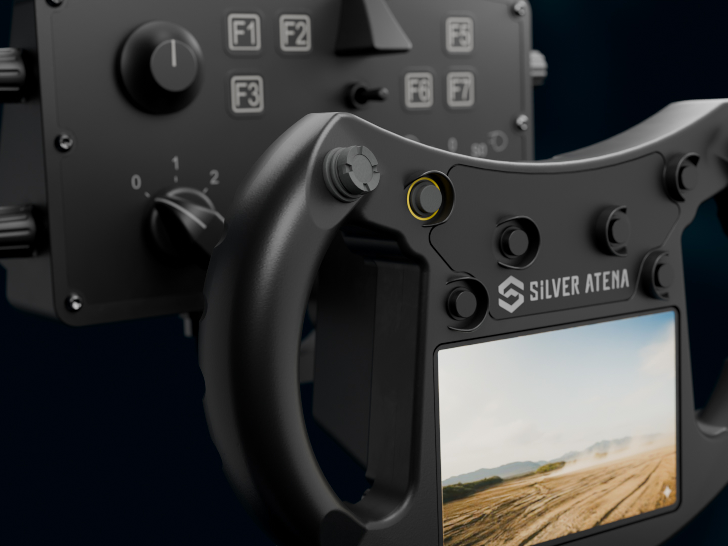 Close-up of a defence control unit with display, controls and ergonomic handle.